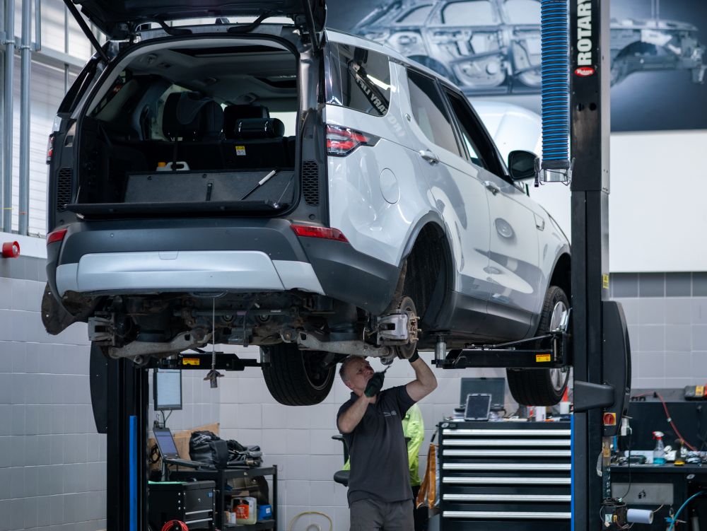 Technician working on a Land Rover
