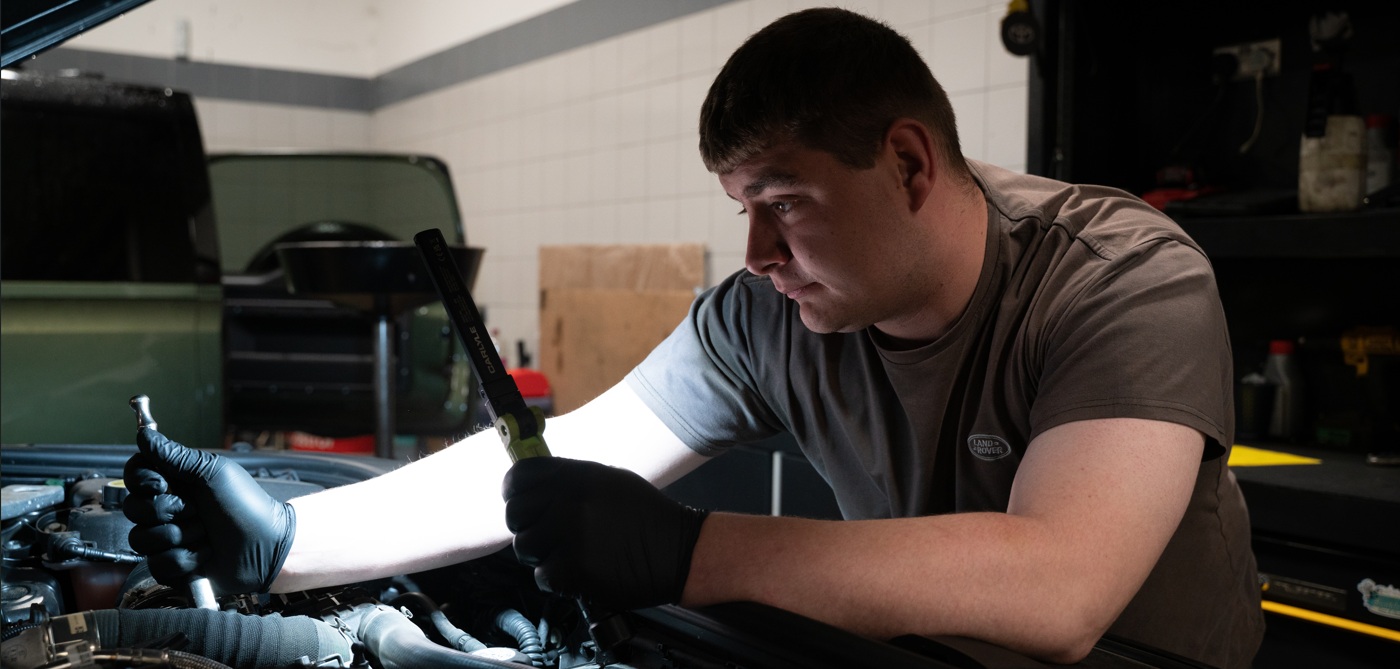 Technician working on a land rover