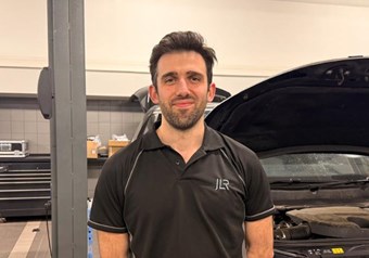 Technician working on a land rover