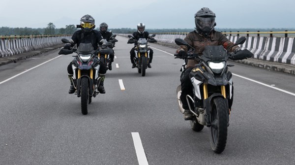 Four BMW Motorrad Bikes and Riders on the road