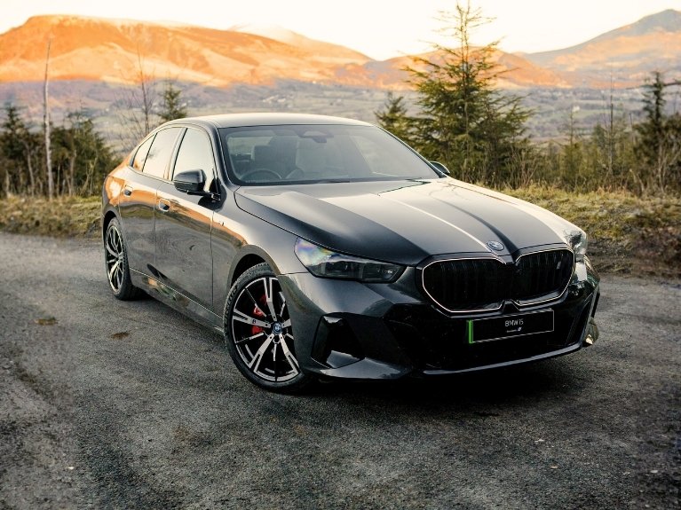 BMW i5 atop a mountain