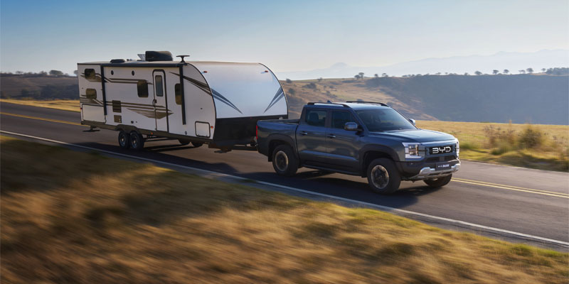 BYD Shark towing Caravan on road