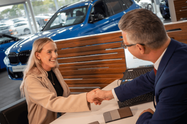 A customer buying BMW at Lloyd BMW