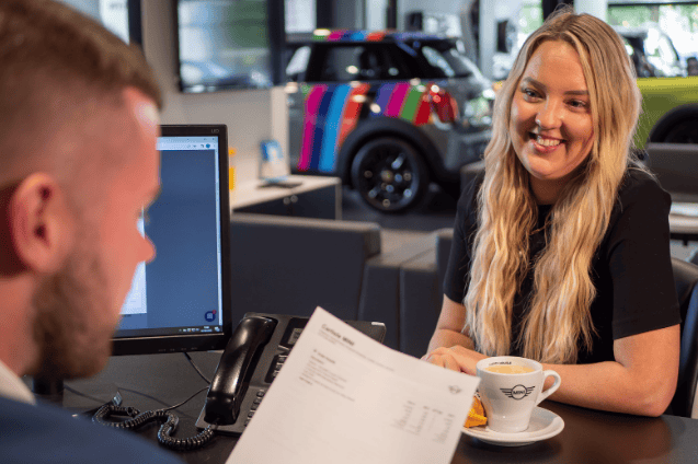 A customer purchasing MINI at Lloyd MINI