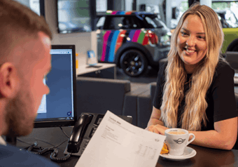 A customer purchasing MINI at Lloyd MINI