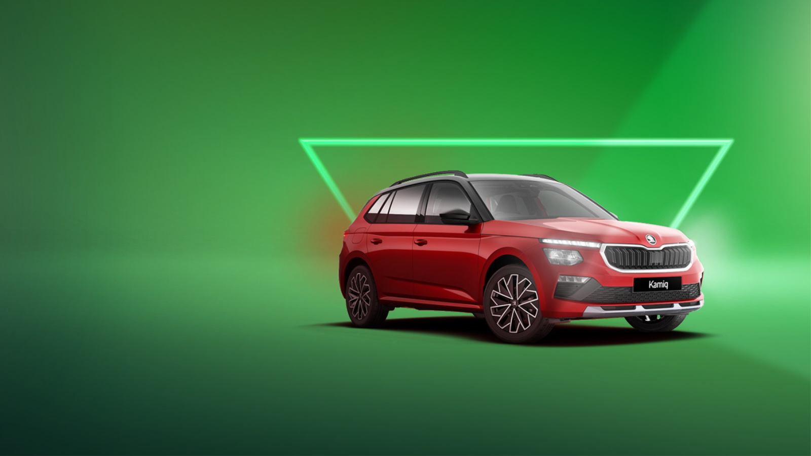 Red Skoda Kamiq on green background