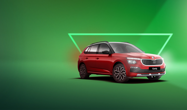 Red Skoda Kamiq on green background