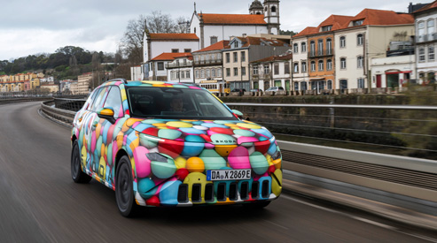 Skoda Epiq dricing with townscape in background