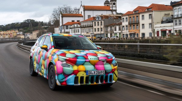 Skoda Epiq dricing with townscape in background
