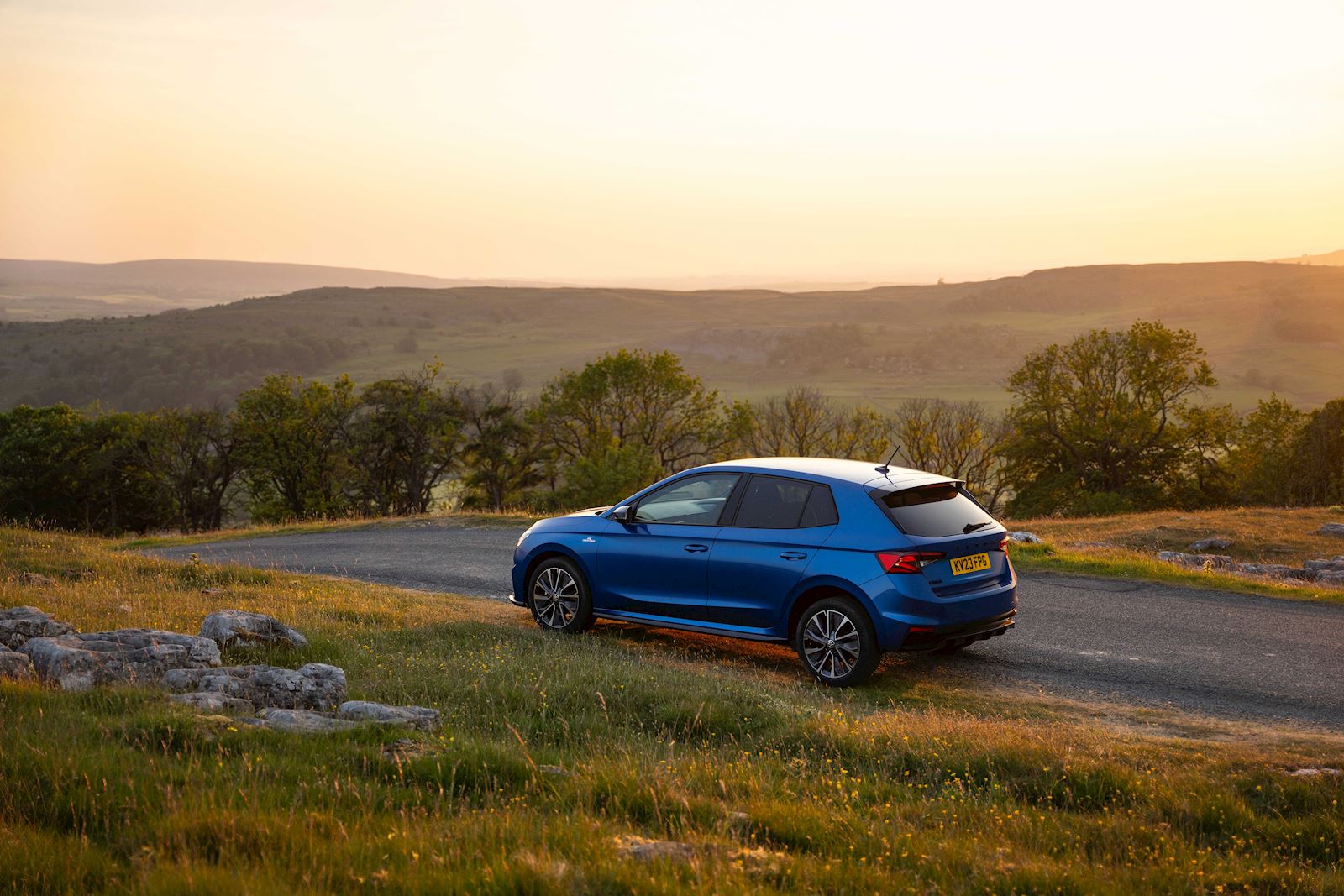 Skoda Fabia in a nature landscape at sunset