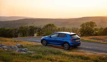 Skoda Fabia in a nature landscape at sunset