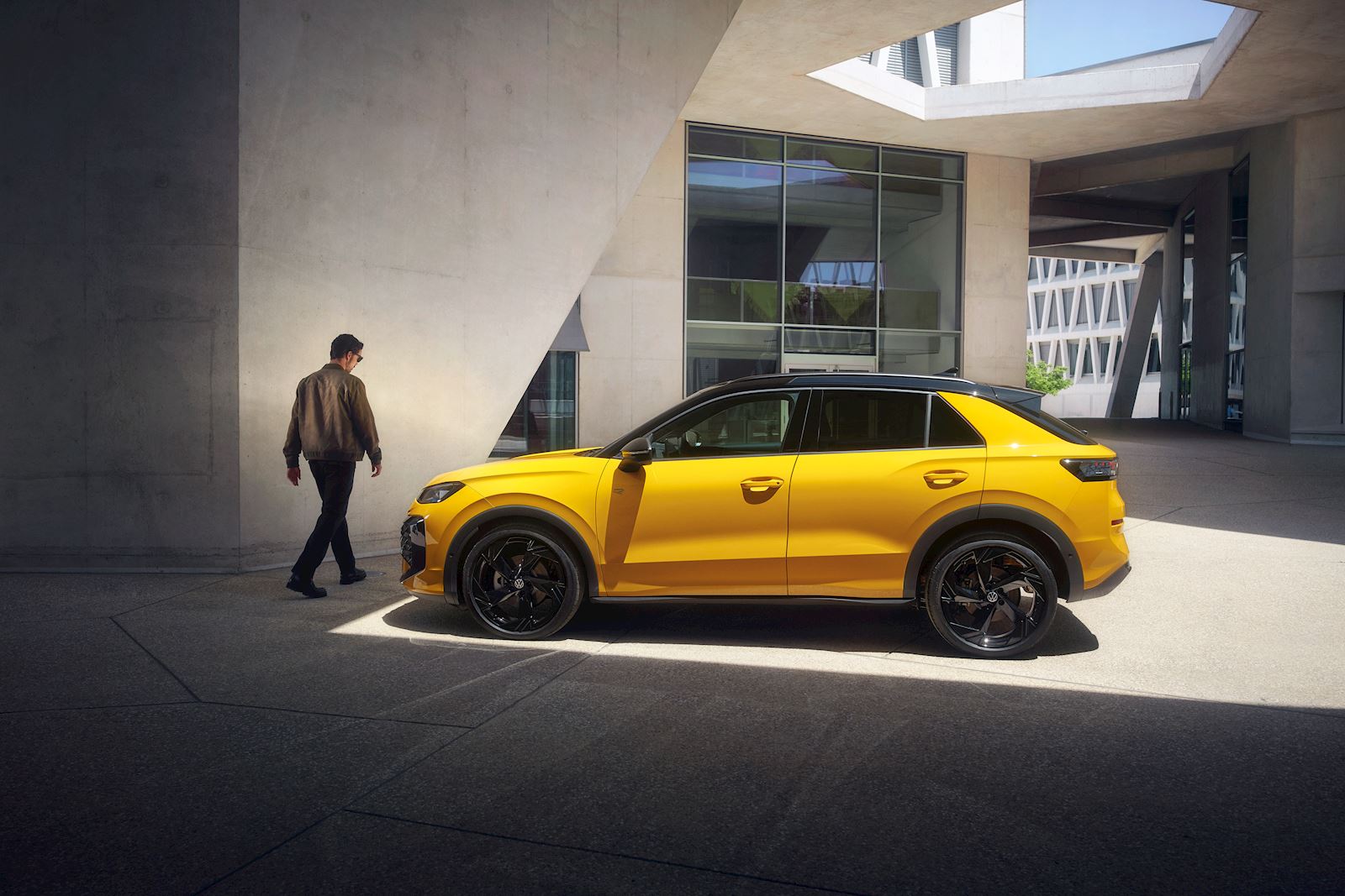 New T-Roc in yellow in concrete building surroundings 