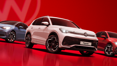 Volkswagen model line up on red gradient background